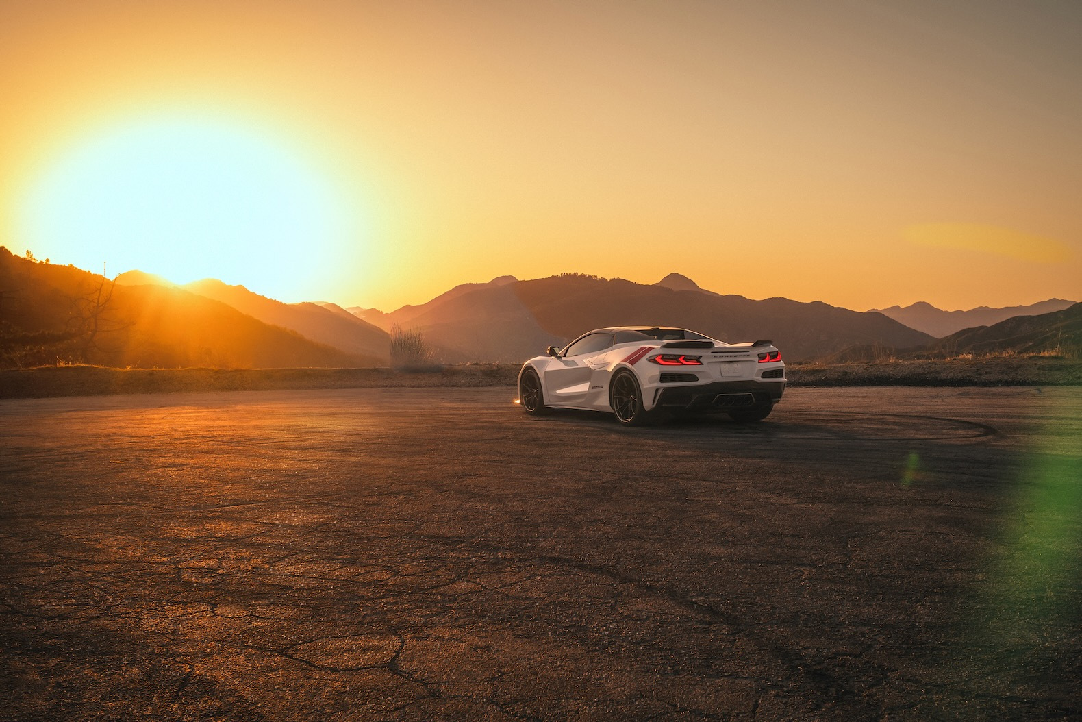 A wide rear view of the 2027 Corvette Grand Sport Launch Edition in Arctic White