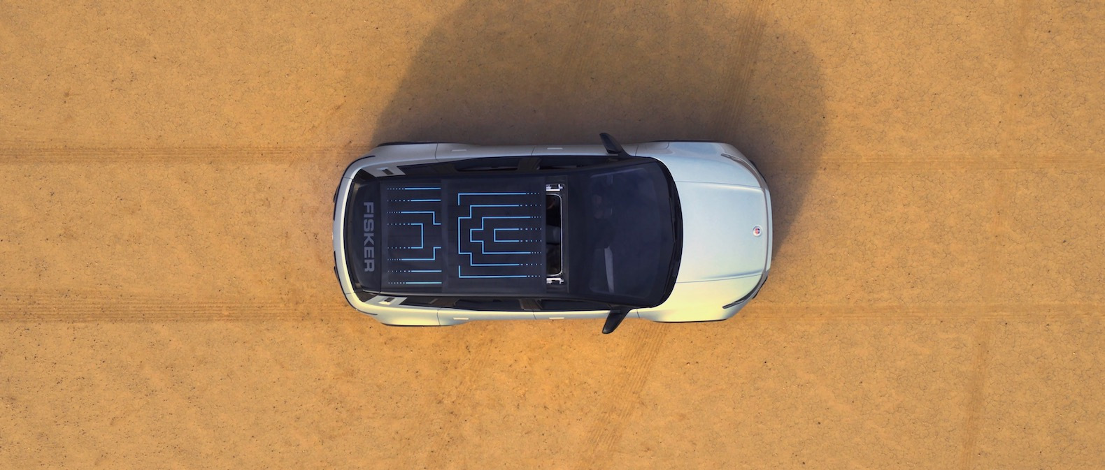 Fisker Ocean Silver in Rabbit Lake; Drone shot top view of the Ocean, roof opening